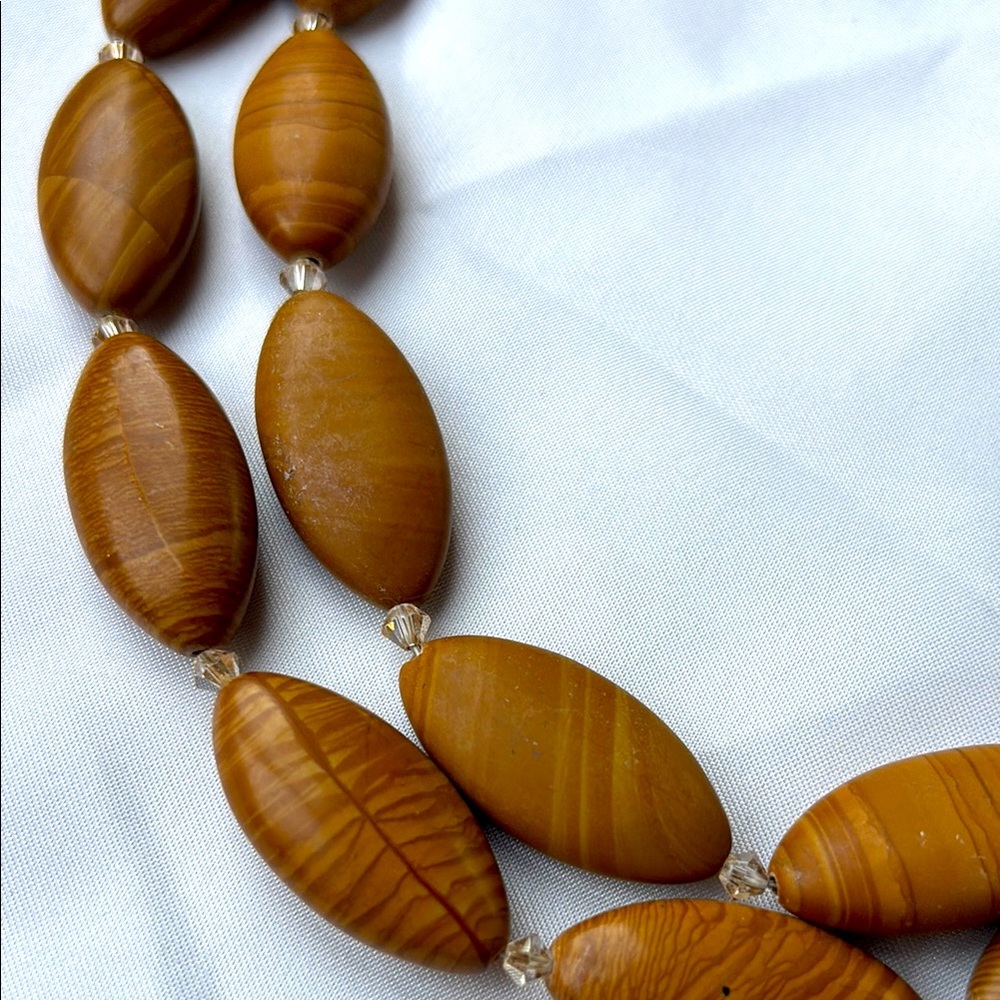 Light brown marble striped stone necklace.